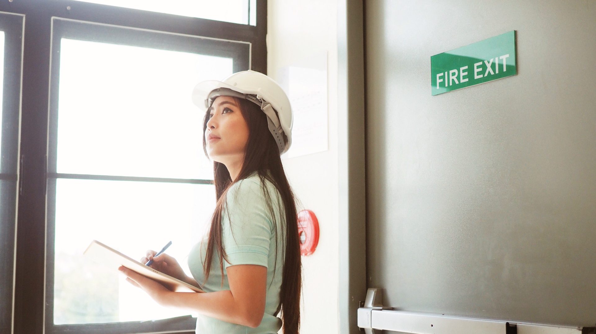 engineering-woman-checking-security-alarm-building