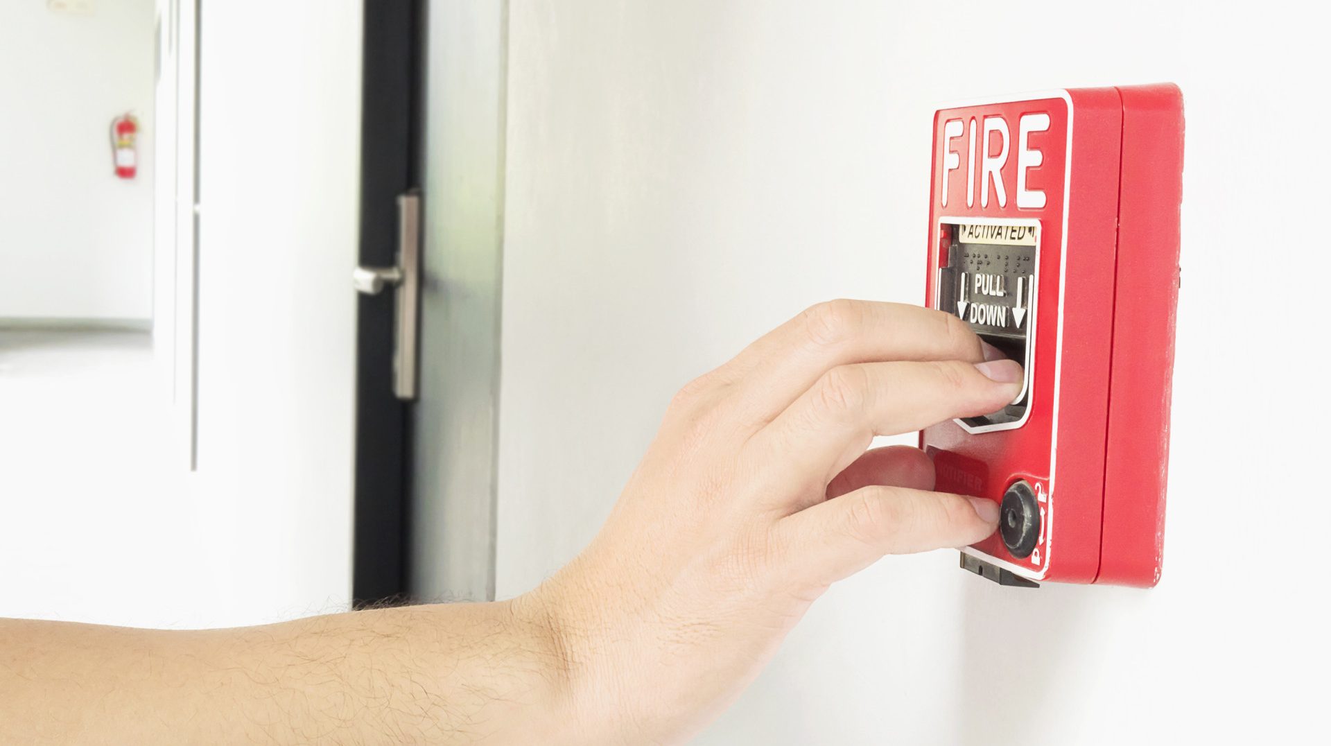 man-is-reaching-his-hand-push-fire-alarm-hand-station (1)